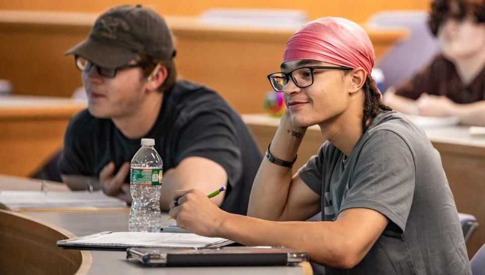 Two students sitting in a Criminology lecture